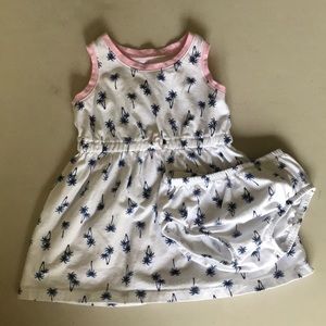 White summer dress with blue palm trees.